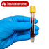 Gloved hand holding a blood test tube