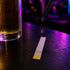Alcohol being dropped onto a cyd test strip in a nightclub scen